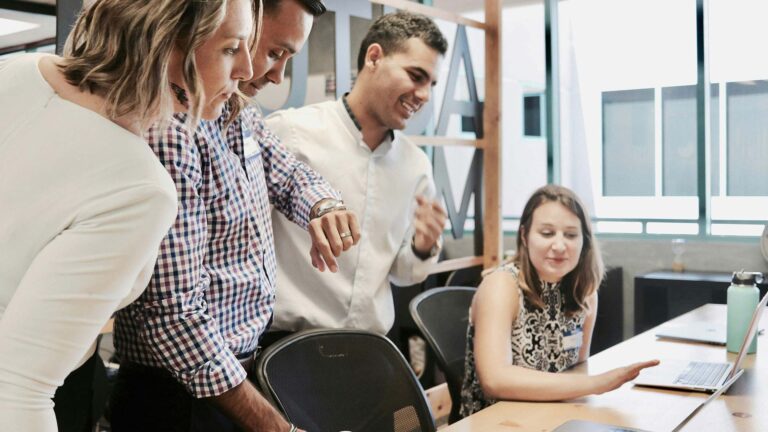 marketing team discussing research data.