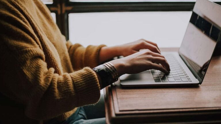 typing on a laptop.